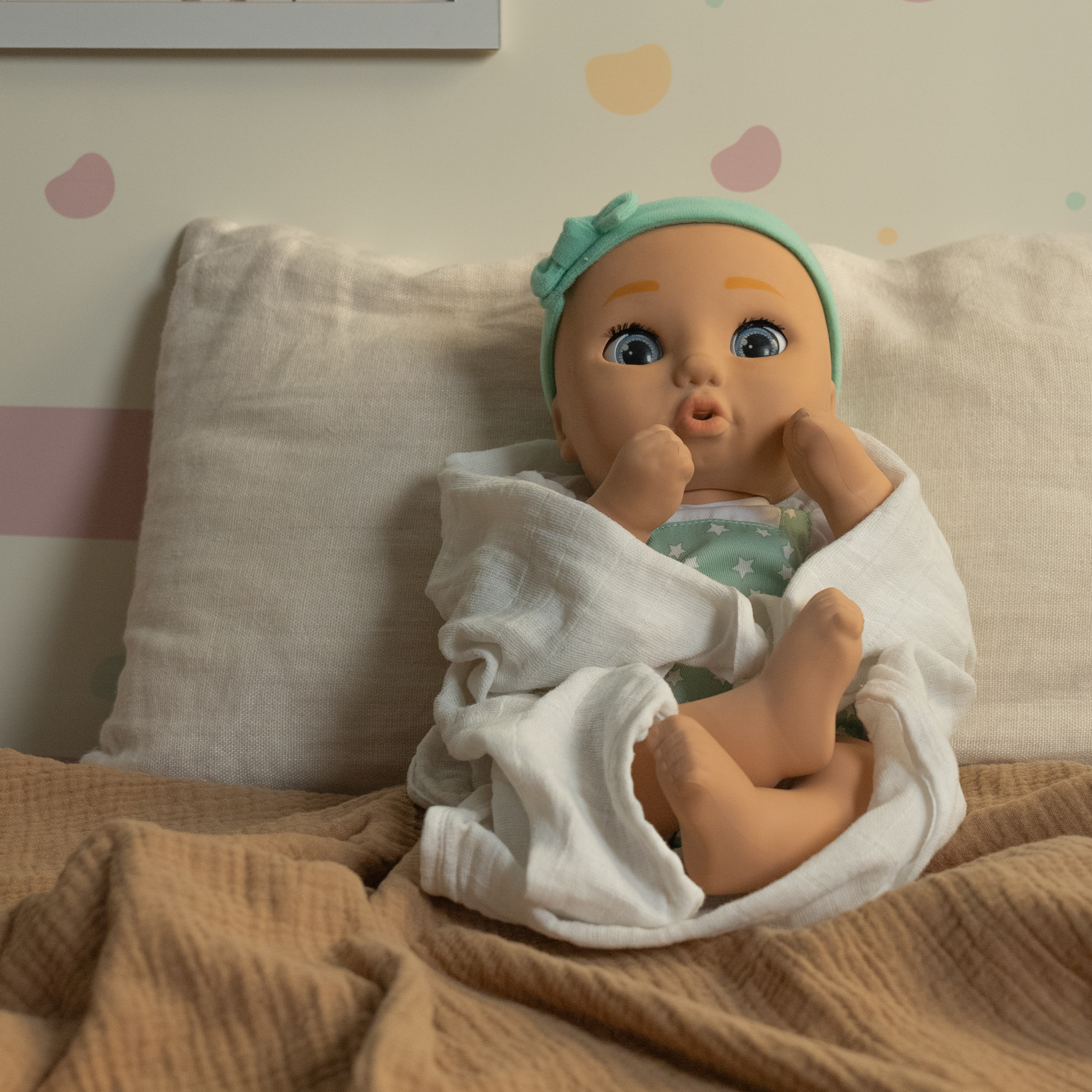 babydoll sam with a blanket in a couch